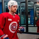 mike-matheson-in-full-hockey-gear-sporting-a-red-montreal-canadiens-jersey