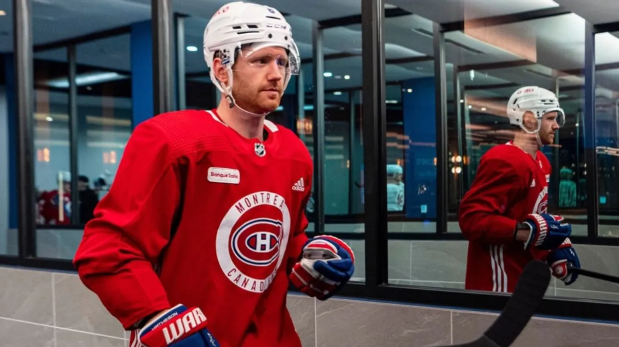 mike-matheson-in-full-hockey-gear-sporting-a-red-montreal-canadiens-jersey